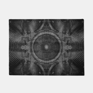 Music speakers on a cracked wall doormat