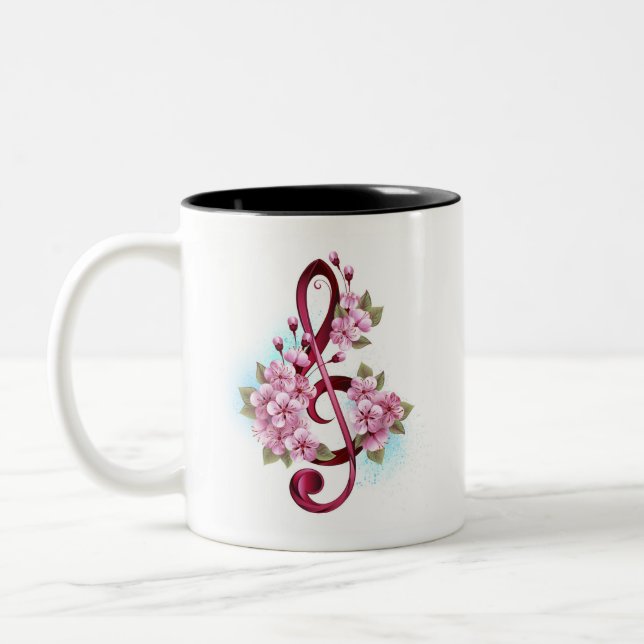 Musical treble clef notes with Sakura flowers Two-Tone Coffee Mug (Left)