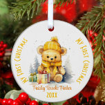 My First Christmas Custom Name Yellow Bear Ceramic Ornament<br><div class="desc">This delightful ornament showcases a charming yellow teddy bear adorned in a yellow hat and bow, cosying up to Xmas gifts; all in a sweet watercolor style. This ornament is designed with personalisation in mind. Edit the text with your baby’s name and the year. “My First Christmas” adorns both sides...</div>