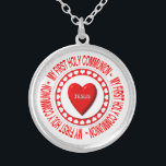 My First Holy Communion Necklace<br><div class="desc">This necklace features a Host surrounded by heats and bearing a "3-D" look heart in the middle with the name of Jesus on it.  Surrounding all this are the words "My First Holy Communion".</div>