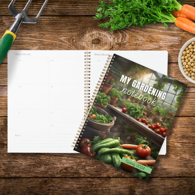 My Gardening Notebook Planner diary (A planner - My Gardening Notebook - on a wooden table with vegetables and gardening objects)