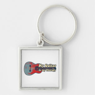 My guitar is my therapy. vintage red and blue key ring
