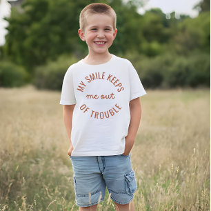My smile keeps me out of trouble  T-Shirt