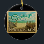 Myrtle Beach Vintage Travel Ceramic Ornament<br><div class="desc">This Greetings From Myrtle Beach vintage postcard design features a sandy beach with a beautiful turquoise ocean water and above the sea,  a blue sky with billowy white clouds. In vintage travels style.</div>