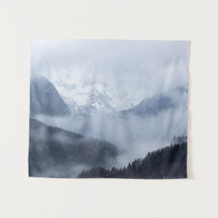 Mysterious fog rolling through layers of mountains tapestry