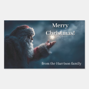 Mysterious Santa Claus Blowing a Glowing Snowflake Rectangular Sticker