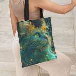 Mystical Feline Tote Bag<br><div class="desc">Carry a touch of the cosmos with our 'Mystical Feline' tote bag. Designed for the extraordinary at heart, this tote features the enigmatic gaze of the cosmic cat against a tapestry of celestial blues and greens, accented with a sprinkle of stardust. It's an everyday accessory for those who carry the...</div>