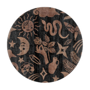 Mystical symbols: snake, sun, moon. cutting board
