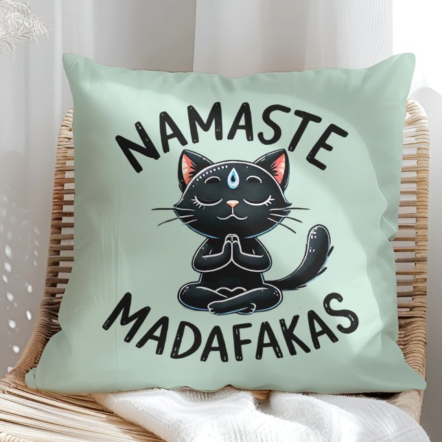 "Namaste Madafakas" Funny Cat Lovers Cushion ("Namaste Madafakas" Funny Cat Lovers Throw Pillow on a sunny boho rattan chair.)