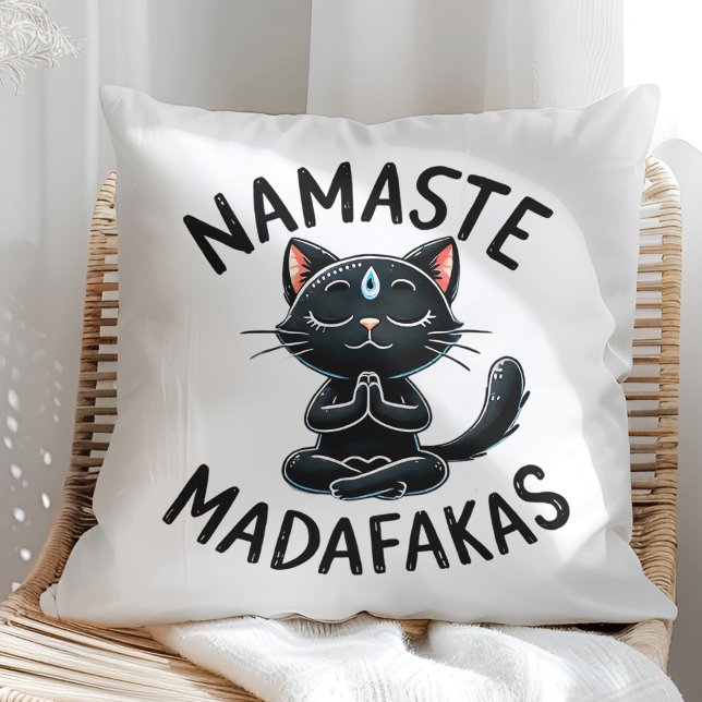 "Namaste Madafakas" Funny Cat Lovers Cushion ("Namaste Madafakas" Funny Cat Lovers Throw Pillow on a sunny boho rattan chair.)