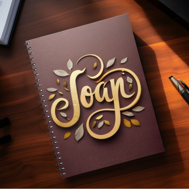 Name Joan  Notebook (Notebook with the name Joan on it lies on top of a desk)