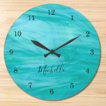 Name Monogram Turquoise Large Clock<br><div class="desc">This colourful Wall Clock is decorated with a turquoise swirl pattern.
Easily customisable with your name or monogram.
Use the Customise Further option to change the text size,  style or colour if you wish.</div>