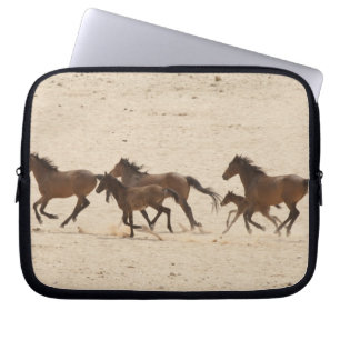 Namibia, Aus. Group of running wild horses on Laptop Sleeve