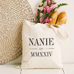 Nanie Roman Numeral Year Established Tote Bag<br><div class="desc">A modern minimalist tote bag to celebrate a chic grandma,  this clean minimal tote features "Nanie" or your choice of grandma nickname in black serif lettering. Customise with the year she became a grandmother beneath in elegant roman numerals for a chic touch.</div>