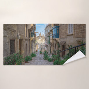 Narrow stone street in Malta Bath Towel