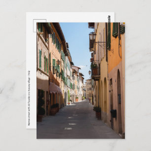 Narrow street with old facades in tuscany village postcard