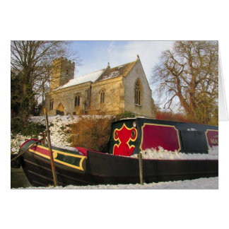 Narrowboat and Church in the snow.