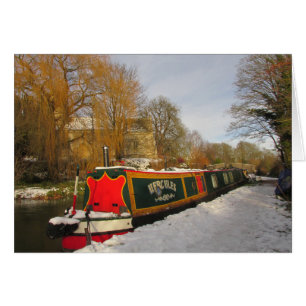 Narrowboat and Church in the snow.