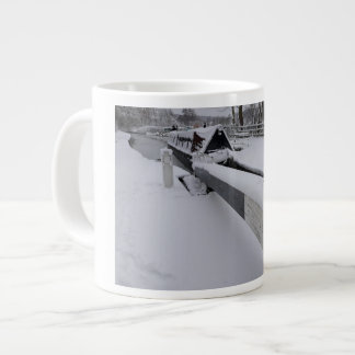 Narrowboat on the canal during a snowy day large coffee mug