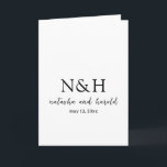 Natasha Monogram Modern Wedding Program<br><div class="desc">Modern folded wedding program featuring a simple and minimal black and white design with your monogram in a bold font along with your names in an elegant handwriting script and your wedding date.</div>