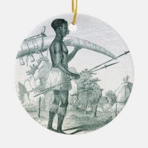 Native carrying a decorated ivory elephant tusk, f ceramic ornament