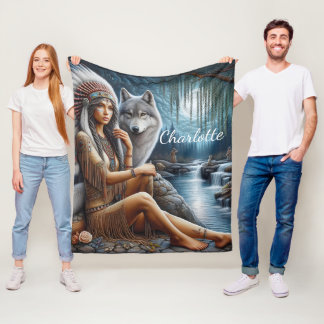 Native woman relaxes by river with wolf fleece blanket