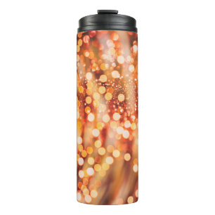 Natural bokeh and bright golden lights thermal tumbler