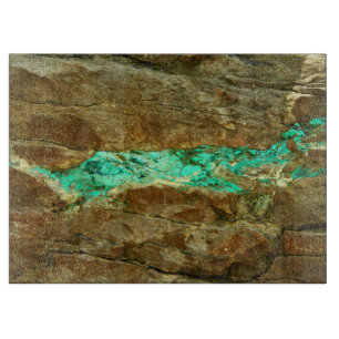 Natural turquoise vein in rough brown stone cutting board