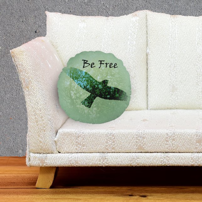 Nature Green Trees Bird Soaring Crow Be Free Round Cushion (Transparent silhouette flying black crow treetops on green decorative pillow.)