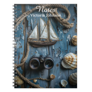 Nautical objects on a wooden background notebook