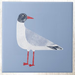 Nautical Seagull Bird Sky Blue Ceramic Tile<br><div class="desc">A fun and cheeky black headed gull standing by the ocean. Perfect for those who love the coast. Original art by Nic Squirrell.</div>