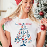 Nautical Tree Beachy Coastal Christmas T-Shirt<br><div class="desc">Bring the sunshine and sea breeze to your holiday wardrobe with this Coastal Christmas Tree Tee! A playful, ocean-inspired twist on tradition—this "SEAson's Greetings" tee stacks up lighthouses, seashells, anchors, tropical fish, sailboats, seahorse, ship wheel and starfish into a festive Christmas tree shaped design. It’s the perfect blend of surf...</div>
