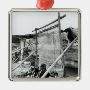 Navajo weavers, c.1914 metal ornament