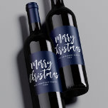 Navy and White Brush Script Merry Christmas Wine Label<br><div class="desc">Festive holiday wine labels featuring "Merry Christmas" displayed in white brush script lettering with a navy background. Personalize the Merry Christmas wine labels with your family name and the year displayed in white lettering.</div>