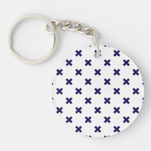 Navy blue cross stitches on white key ring