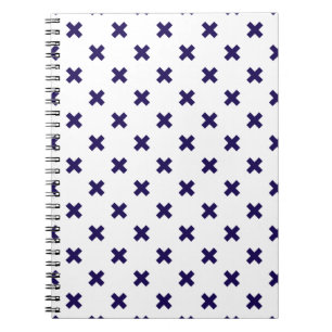 Navy blue cross stitches on white notebook