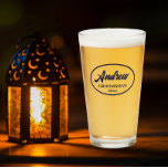 Navy Blue Stylised Wedding Groomsman Name Glass<br><div class="desc">Beer glass for the wedding groomsman that features his name printed in navy blue,  stylised script inside a navy blue colour oval border along with wedding date. A great party supply idea for a bachelor party! Personalise your beer glass by editing and replacing name and date with your own.</div>