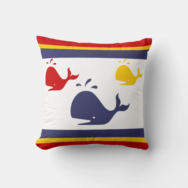 navy blue, yellow, and red whales on white cushion (Front)