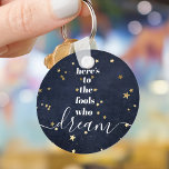 Navy Gold Stars Fools Who Dream Quote Typography Key Ring<br><div class="desc">“Here’s to the fools who dream.” Be one of those who always lets their optimism control their vision and aspirations. This rich, modern, graphic, minimalist keychain combines white bold, san-serif typography and handwritten calligraphy script, against a midnight navy denim background sprinkled with faux gold foil stars. This keychain comes in...</div>