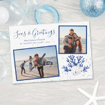 Navy Seas & Greetings Beach Christmas 2 Photo Holiday Card<br><div class="desc">This beach inspired Christmas card features two framed photos,  a white sand dollar and 2 white starfish on navy blue glitter coral,  and “Seas & Greetings” in a trendy handwriting script font.</div>