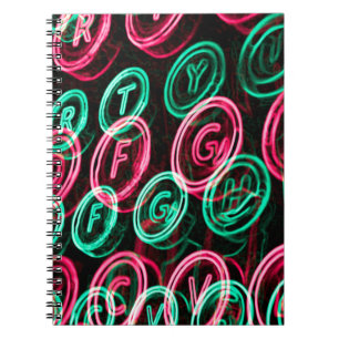 Neon typewriter keys close up notebook