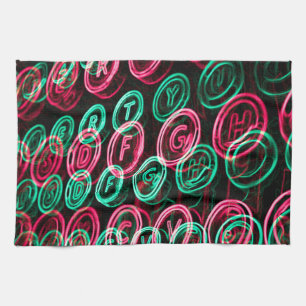 Neon typewriter keys close up tea towel