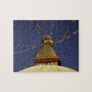 Nepal, Kathmandu. Under prayer flags, watchful Jigsaw Puzzle