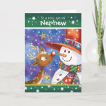 Nephew, Cute Reindeer and Snowman Holiday Card<br><div class="desc">For Nephew. A really cute,  colourful Christmas card. The illustration shows a sweet baby deer with big open eyes and a fun snowman in a huge hat looking fondly,  nose to nose,  at each other. They are set against a blue watercolor sky and snow is falling around them.</div>