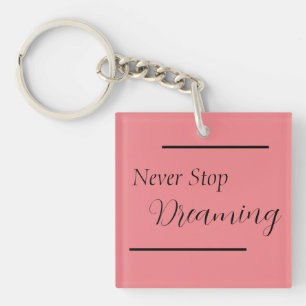 "Never Stop Dreaming" Phrase Black Lettering Key Ring