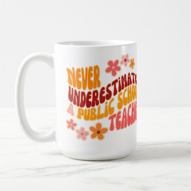 Never Underestimate A Public School Teacher Coffee Mug (Left)