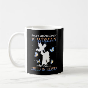 Never underestimate a woman who has a child in hea coffee mug