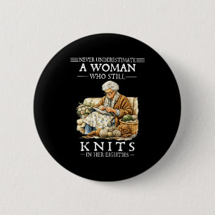 Never underestimate a woman who still knits  6 cm round badge