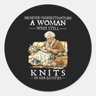 Never underestimate a woman who still knits classic round sticker
