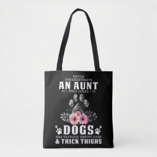 never underestimate an aunt who loves dogs has tat tote bag